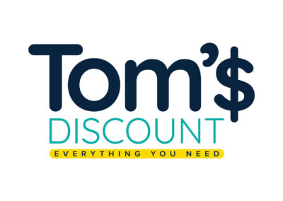 Tom's Discount full color logo with tagline Everything you Need